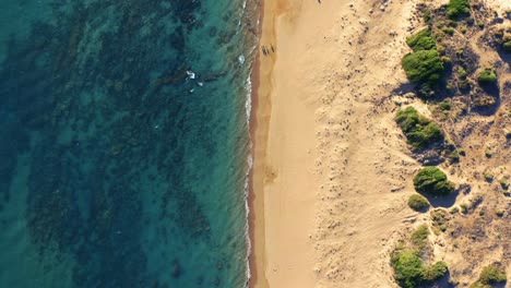 Aerial-view-of-sea-and-sand-beach-at-sunset