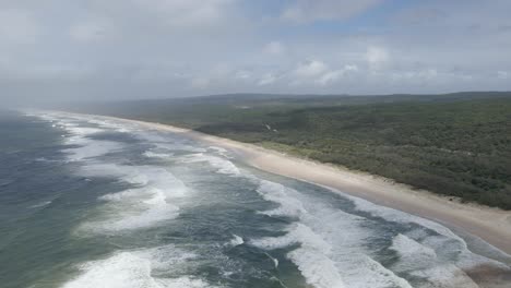 View-Of-Long-Stretch-Of-Main-Beach-With-Vegetated-Landscape-In-North-Stradbroke-Island,-Queensland,-Australia