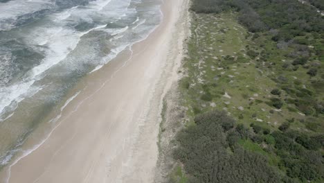 Aerial-View-Of-Popular-Main-Beach-And-Camping-Ground-Near-Brisbane-In-North-Stradbroke-Island,-QLD,-Australia