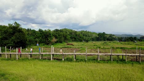 The-bamboo-bridge-across-rice-fields-of-Su-Tong-Pae-in-a-small-town-of-Pai-Mae-Hong-Son-province-Thailand