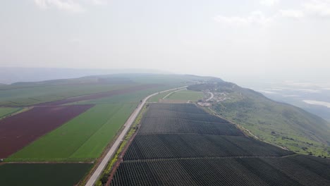 Aerial-view-of-agricultural-fields-at-Israel,-Golan-Heights,-Mevo-Hama