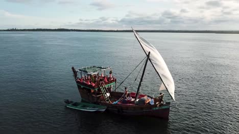 Aerial-shot-of-boat-sailing-around-Kenyan-coast,-popular-holiday-and-recreation-destination-of-Watamu