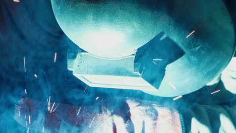 Factory-Worker-is-Welding-in-Protective-Helmets-and-Glasses,-slow-motion,-close-up