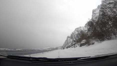 Road-covered-in-snow-in-Norway,-view-from-the-car