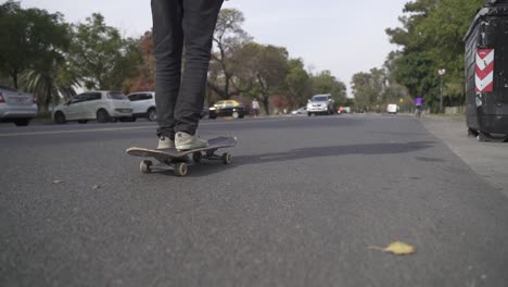 Skater-riding-skateboard-on-the-street-close-to-park
