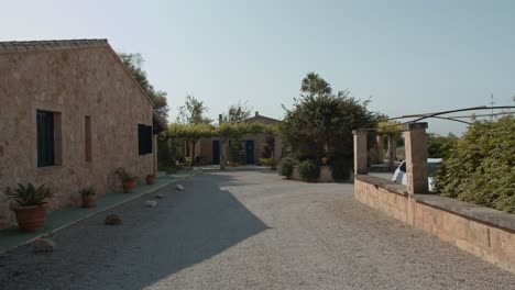 wide-view-of-spanish-rural-houses-in-the-middle-of-the-road-in-mallorca-islands