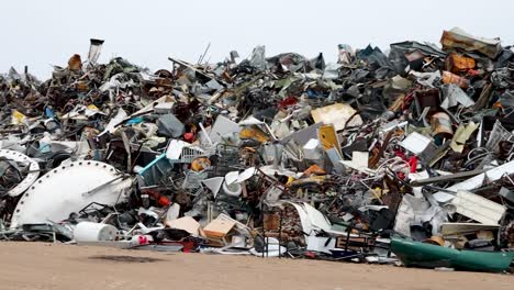 Scrap-Metal-junk-pile-in-Northern-Canada-Subarctic-village-of-Churchill-Manitoba-pan-left