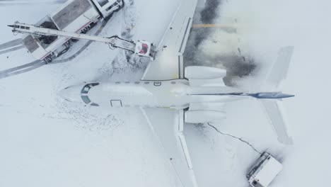Deicing-hose-spraying-anti-icing-chemicals-on-exterior-of-private-business-plane