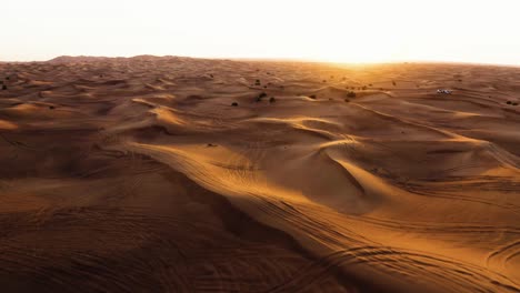Aerial-Forward-Shot-Of-Sand-Dunes-In-The-Desert-At-Sunset