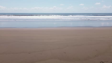 Calm-static-shot-of-waves-crashing-onto-beach-in-Costa-Rica
