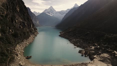 aerial-of-Lake-Paron,-Pyramid-Mountain,-Andean-Cordillera-in-Peru-Huascaran-National-Park,-Peruvian-Hiking-Destination