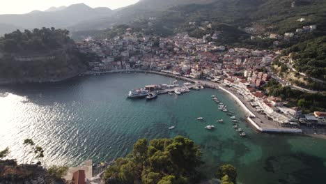 Aerial-View-Of-Parga-Port-On-Sunny-Day-With-Boats-Moored-In-The-Ionian-Sea