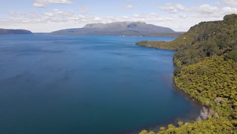 Aerial-jib-up-of-the-incredible-Lake-Tarawera,-New-Zealand