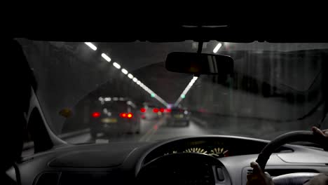 POV-Inside-Car-Driving-Through-Dark-Tunnel-Road-Near-Heathrow-Airport