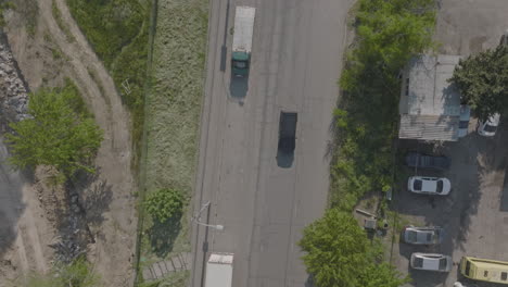 Top-down-aerial-shot-of-cars-traveling-along-a-street-in-eastern-europe