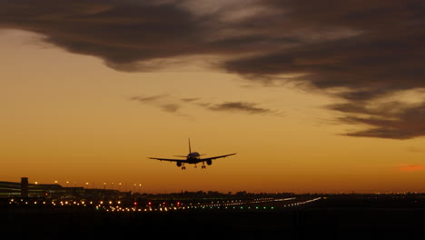 Barcelona-airport-runway-at-sunset,-plane-landing.-Static