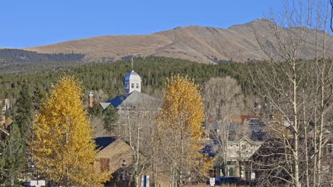 Handheld-domed-building-with-Bald-mountain-in-the-distance-and-golden-Aspens