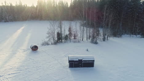 Isolated-lonely-tiny-wooden-cabin-homes-at-Nuuksion-Taika-Vihti-Finland-aerial