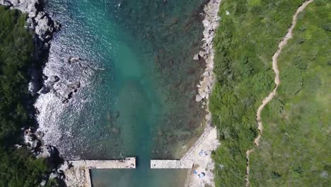 Ancient-remains-of-Roman-port-in-Italy,-aerial-top-down-view