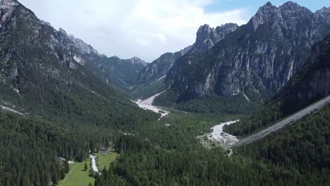Iconic-landscape-of-Alps-wth-forest-and-mountain-ranges,-aerial-view