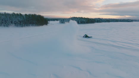 Tractor-snow-blower-clearing-Norbotten-Lapland-ice-drifting-racetrack-aerial-view