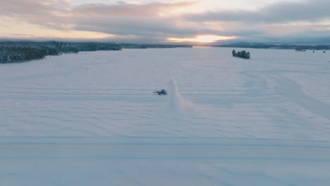 Tractor-snow-blower-clearing-Norbotten-Lapland-snow-covered-drifting-track-aerial-view