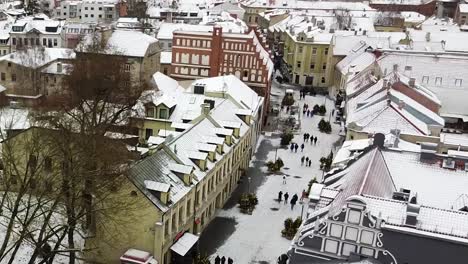 Majestic-old-town-of-Kaunas-city-in-winter-season,-aerial-rooftops-view