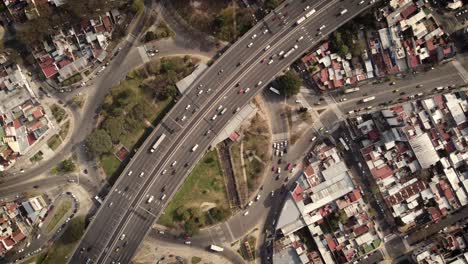 Timelapse-of-cars-driving-along-highway-25-de-Mayo-and-big-roundabout,-Plaza-de-Los-Virreyes-in-Buenos-Aires