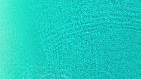 Aerial-view-above-shallow,-turquoise-waters-of-Cancun,-Mexico---cenital,-drone-shot