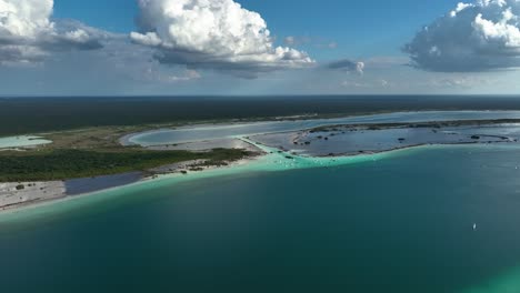 Aerial-view-towards-boats-at-the-Pirates-channel,-in-the-Bacalar-Lagoon,-sunny-Mexico