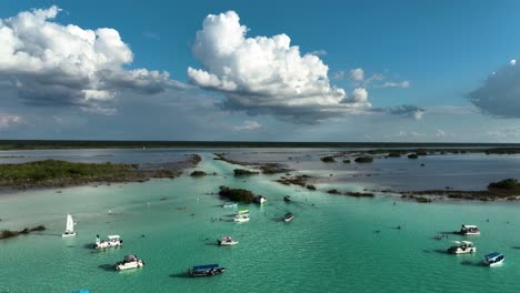 Aerial-view-over-boats-at-the-Pirates-channel,-in-the-Bacalar-Lagoon,-sunny-Mexico