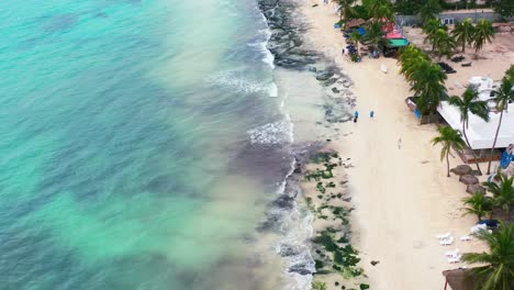 tropical-white-sand-rocky-beach-coastline-in-Playa-Del-Carmen-Mexico,-aerial
