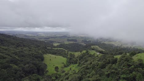 Low-Clouds-Over-Lush-Green-Trees-And-Hills