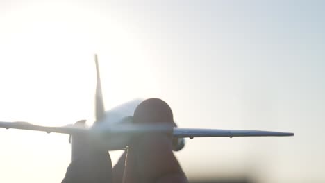Closeup-Of-Toy-Airplane-Played-By-Hand-Against-Sunlight