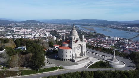 Breathtaking-drone-view-of-the-castle-above-the-town-of-viana-do-castelo-in-portugal,-sun