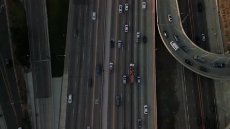 Aerial-tracking-and-tilting-up-shot-of-traffic-patterns-on-the-freeway-in-West-Los-Angeles-during-rush-hour