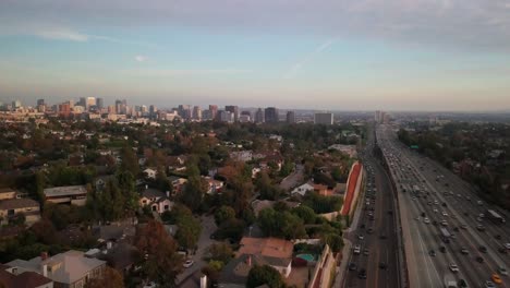 Aerial-of-urban-Wilshire-corridor-with-Westwood-and-freeway-in-West-LA-during-rush-hour