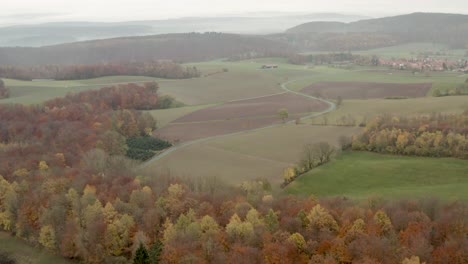 Beautiful-Drone-Aerial-Shot-of-the-Harz-national-park-forest-in-north-Germany-at-a-cloudy-moody-day-in-late-autumn