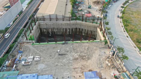 Rotating-view-of-deep-and-large-pit-in-the-ground-at-construction-site