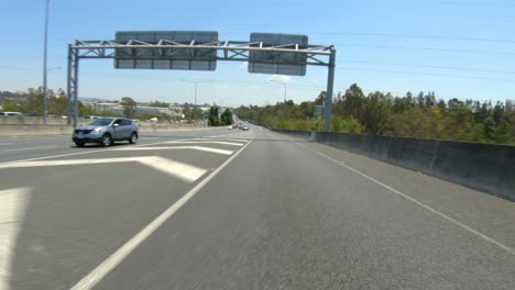 Rear-facing-driving-point-of-view-POV-of-Australian-suburban-freeways-and-city-streets---ideal-for-interior-car-scene-green-screen-replacement