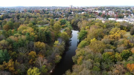 Aerial-view-of-the-Conestoga-River-in-Lancaster-Pennsylvania-during-autumn,-colorful-fall-foliage