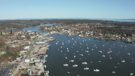 Aerial-High-Fly-Over-Drone-Footage-showing-overview-of-Maine-Coast,-Vinalhaven,-Fox-Islands,-Knox-County-Maine,-USA