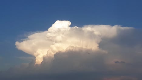 Huge-mushroom-atomic-like-time-lapse-of-summer-clouds-before-a-thunderstorm,-looks-like-an-explosion-as-it-rolls-up-to-the-atmosphere