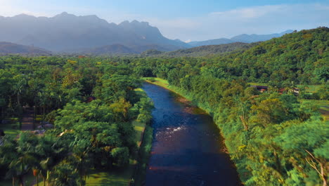 Amazon-river-in-tropical-green-forest-with-mountains-in-background