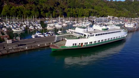 Drone-Flying-Around-An-Abandoned-Ferry-Moored-At-The-Harbor-In-Browns-Point,-Tacoma---aerial