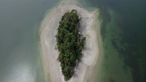 Aerial,-reverse,-drone-shot,-over-the-Dead-Man's-Island,-in-Cutts-Island-State-Park,-on-a-overcast-day,-Washington-state,-USA