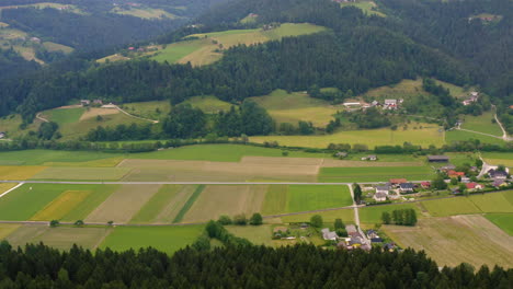 Aerial-pan:-mountains,-meadows-and-slovenj-gradec-villages-in-slovenia