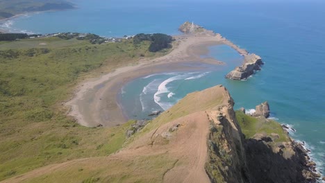Flyover-of-Castle-Rock-and-Castlepoint-on-the-coast-of-Wairarapa,-New-Zealand