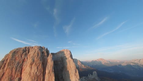 Cinque-Torri,-Dolomites,-Northeastern,-Italy---Fascinating-Spiky-towering-limestone-and-meadow-and-alps-plus-the-lovely-sunrise---Drone-footage
