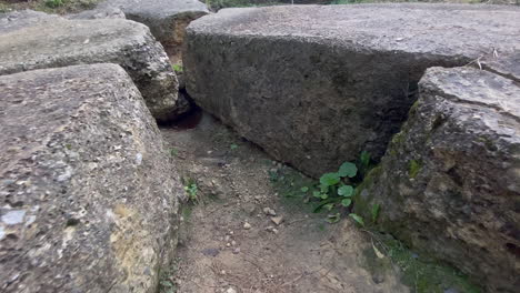 Close-Up-Gimbal-Shot-of-excavated-Stones-and-manmade-Concrete-materials-and-textures-on-top-of-the-Bosnian-sun-pyramid